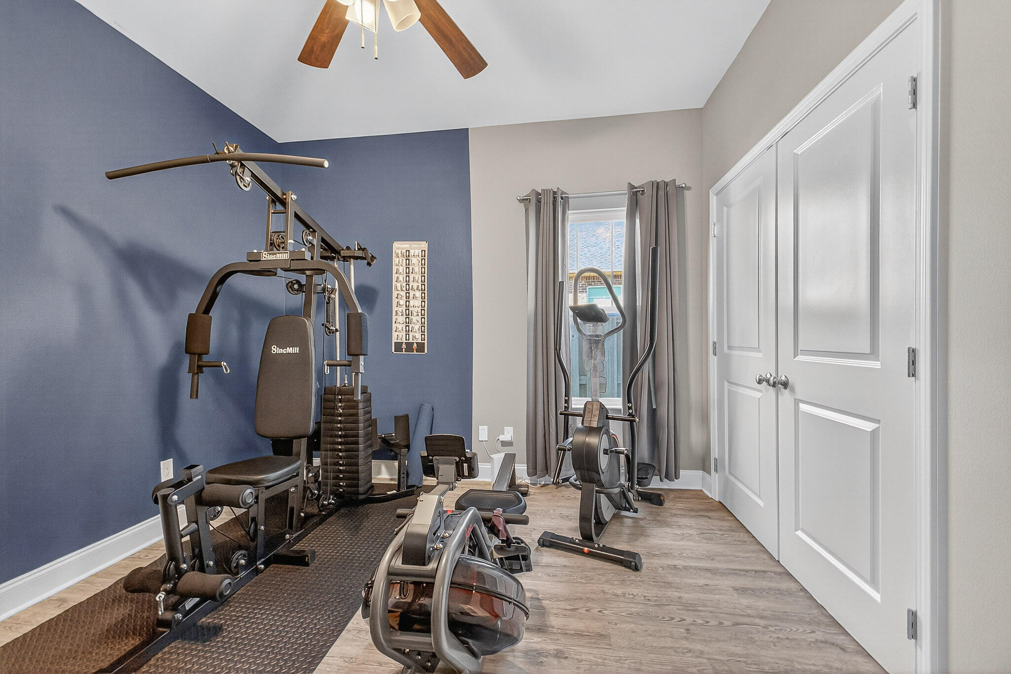 61 B 6th Street Shalimar, FL 32579 - Photo 15 of 59 a room with gym equipment and mirrors