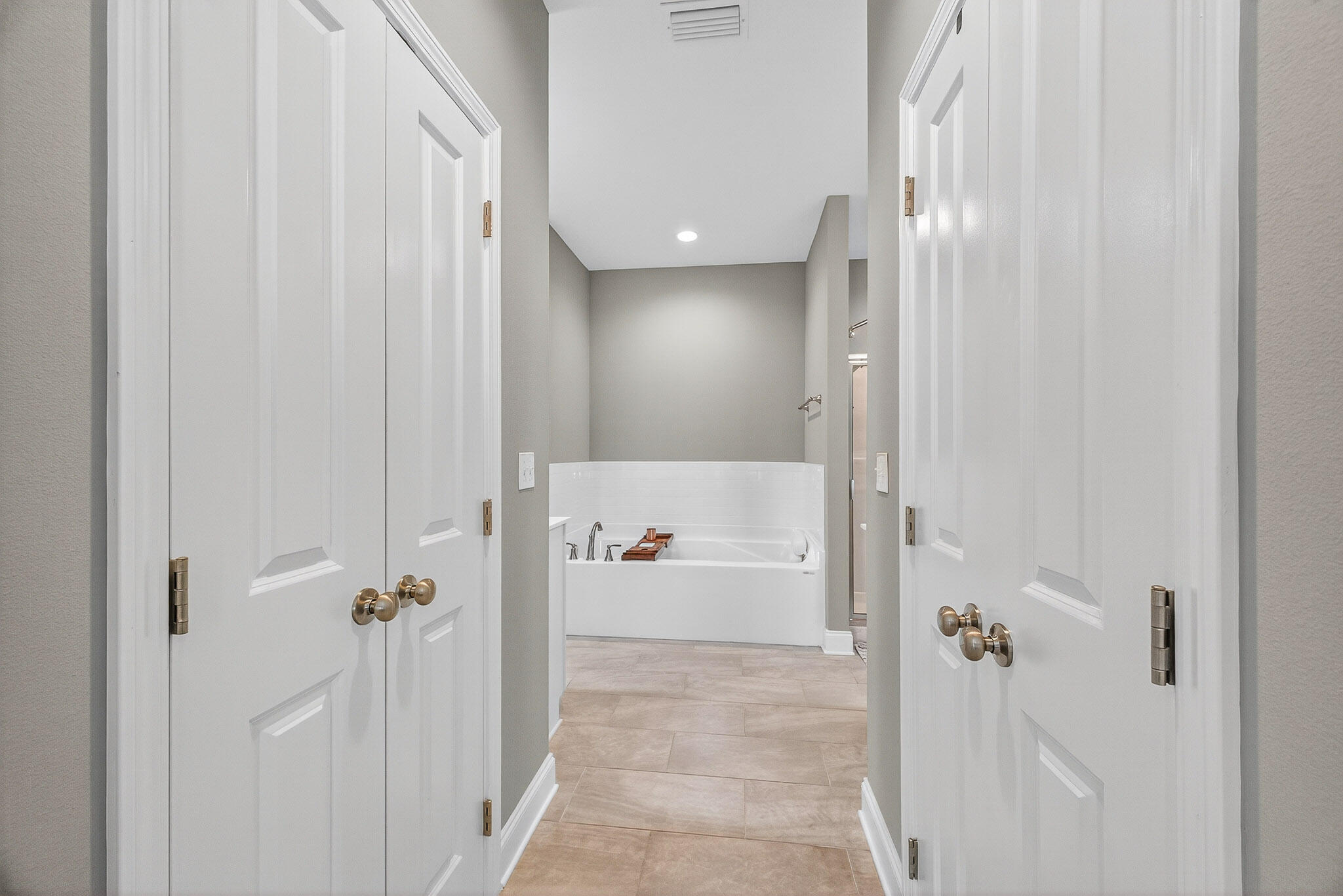 61 B 6th Street Shalimar, FL 32579 - Photo 27 of 59 a bathroom with a bathtub and a shower