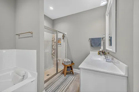 a kitchen with stainless steel appliances granite countertop a refrigerator and a dining table