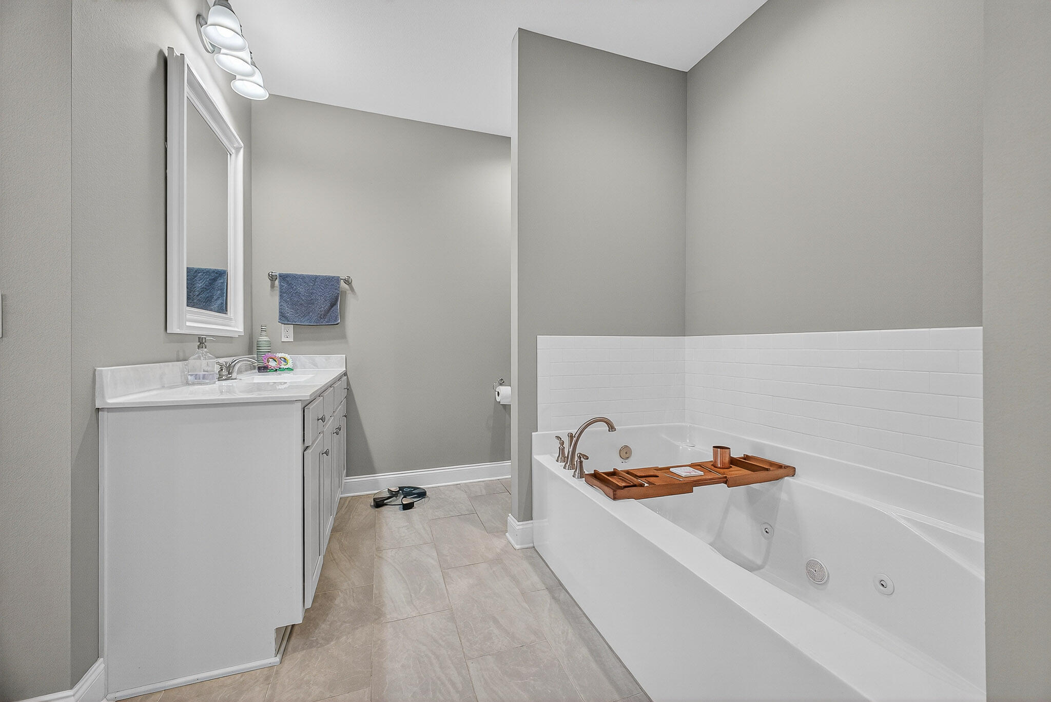 61 B 6th Street Shalimar, FL 32579 - Photo 30 of 59 a bathroom with a tub sink and mirror