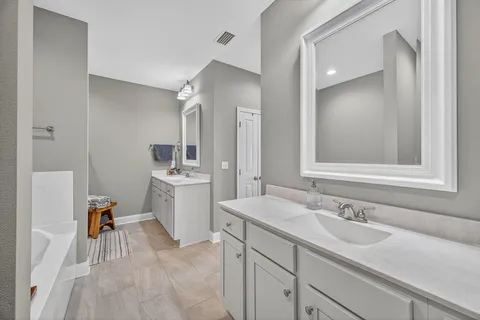 a kitchen with kitchen island a sink stove and wooden cabinets