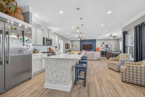 a kitchen with a sink stove and cabinets
