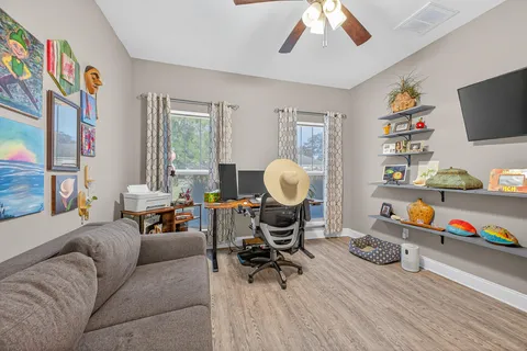 a white toilet sitting next to a small bathroom