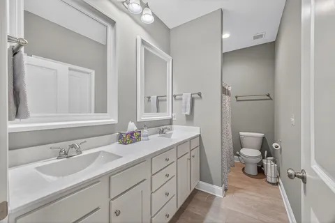 a hallway with a dining table and chairs