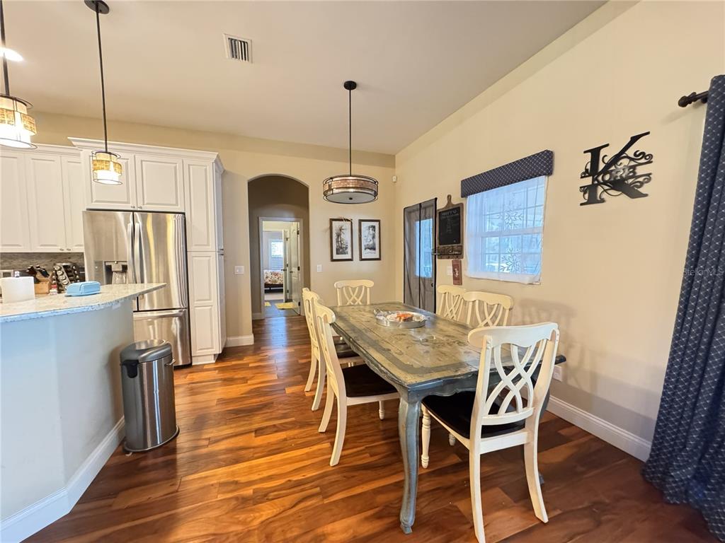 3108 North Wheaton Point Hernando, FL 34442 - Photo 12 of 35 a view of a dining room with furniture window and wooden floor