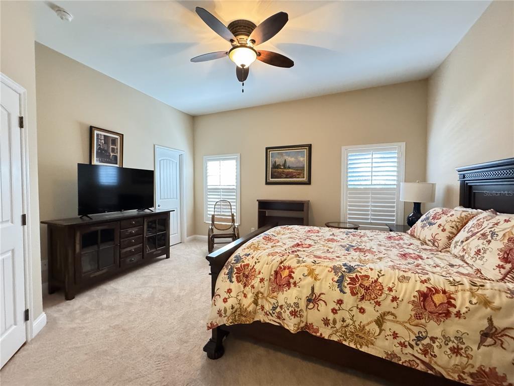 3108 North Wheaton Point Hernando, FL 34442 - Photo 16 of 35 a bedroom with a bed and a flat screen tv