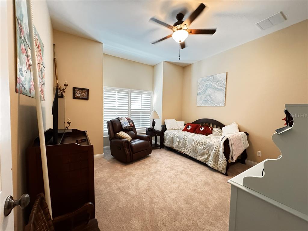 3108 North Wheaton Point Hernando, FL 34442 - Photo 19 of 35 a bed room with a bed and a couch