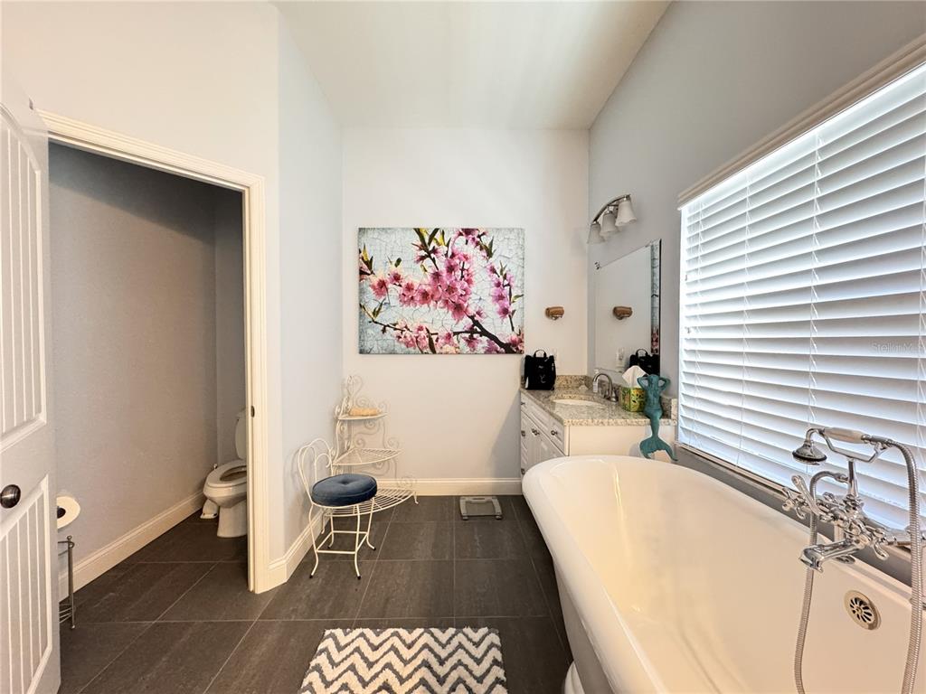 3108 North Wheaton Point Hernando, FL 34442 - Photo 22 of 35 a bathroom with a sink a toilet and shower