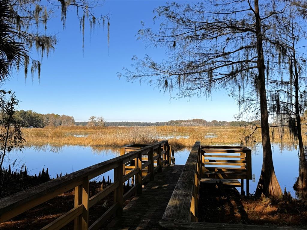 3108 North Wheaton Point Hernando, FL 34442 - Photo 32 of 35 a view of a terrace with wooden floor and lake view