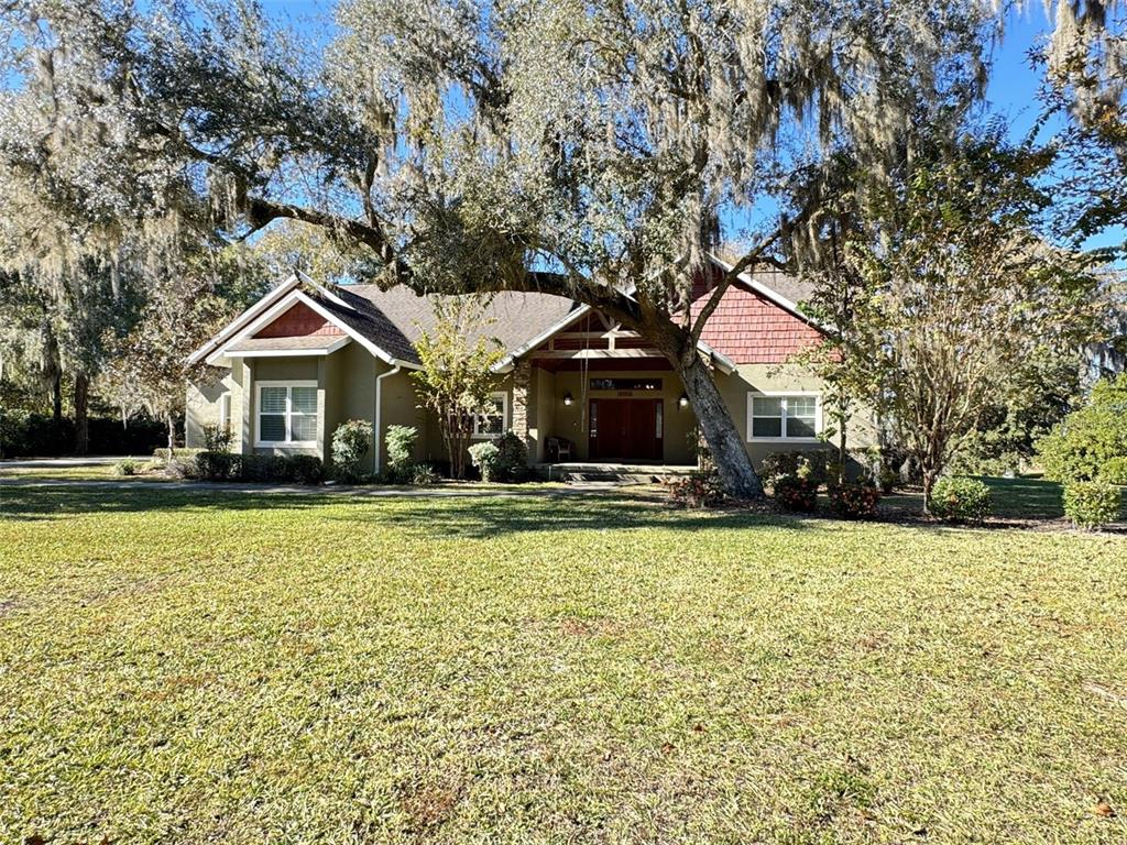 3108 North Wheaton Point Hernando, FL 34442 - Photo 34 of 35 a front view of a house with a yard and garage