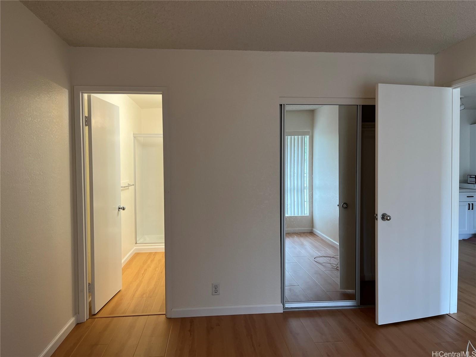 432 Mananai Place, Unit 18C Honolulu, HI 96818 - Photo 7 of 17 a view of a bathroom from a hallway