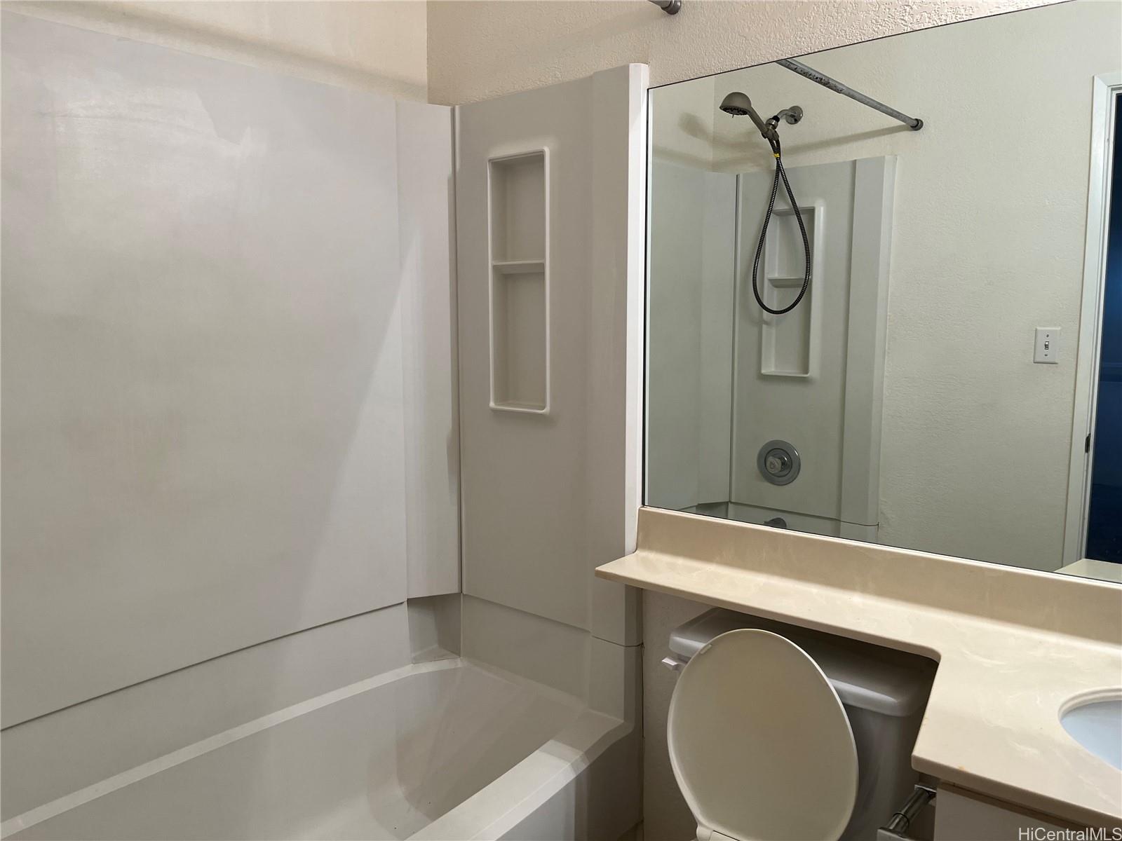 432 Mananai Place, Unit 18C Honolulu, HI 96818 - Photo 10 of 17 a bathroom with a sink a toilet and shower