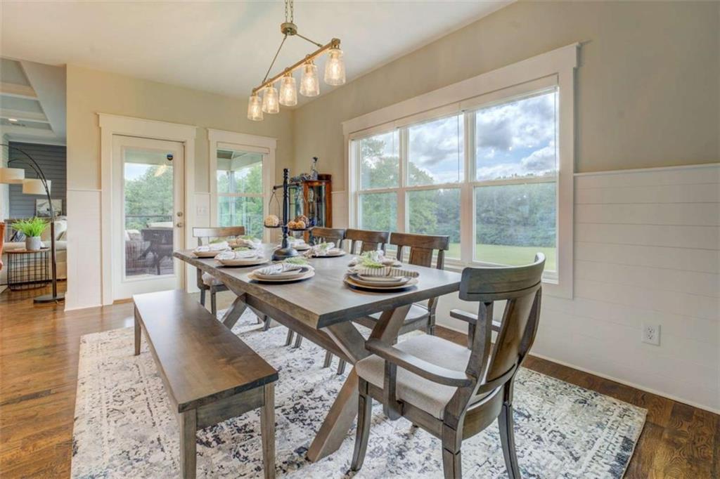 3076 East Lake Road McDonough, GA 30252 - Photo 17 of 49 a view of a dining room with furniture window and wooden floor