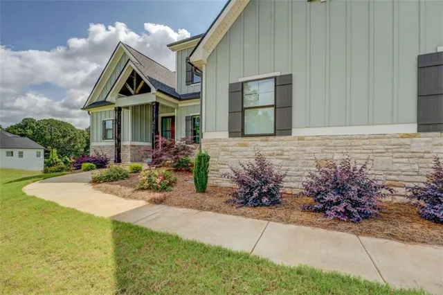 a front view of a house with garden