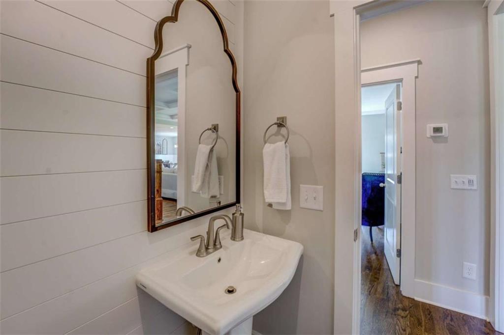 3076 East Lake Road McDonough, GA 30252 - Photo 22 of 49 a bathroom with a sink and a mirror