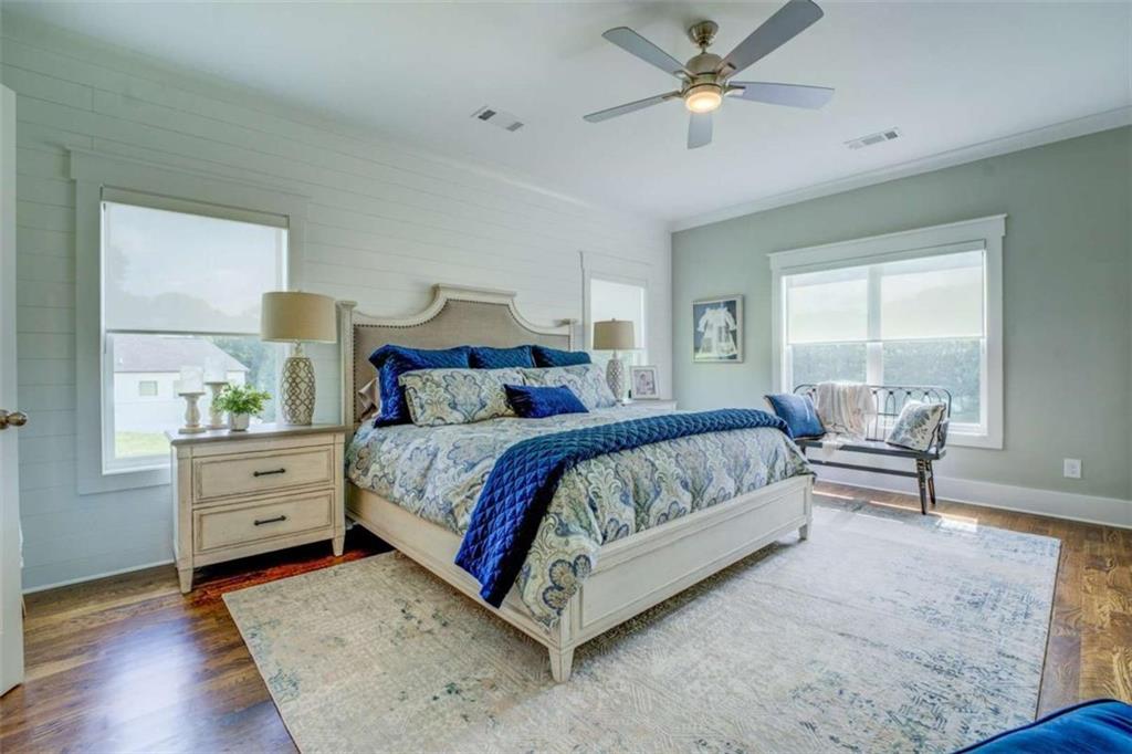 3076 East Lake Road McDonough, GA 30252 - Photo 23 of 49 a spacious bedroom with a bed and a window