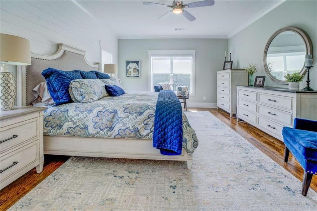 3076 East Lake Road McDonough, GA 30252 - Photo 24 of 49 a spacious bedroom with a bed dresser and a window