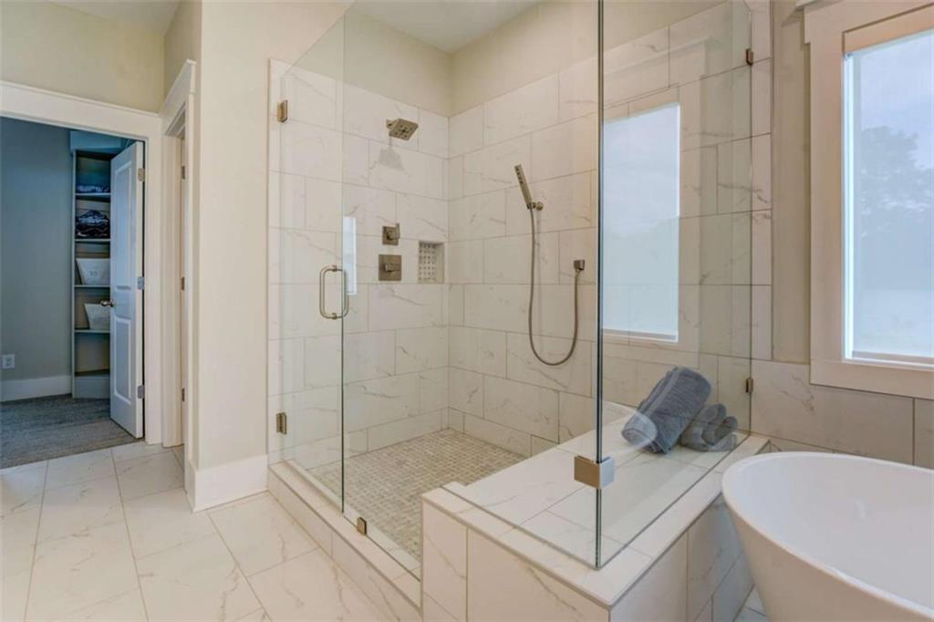 3076 East Lake Road McDonough, GA 30252 - Photo 27 of 49 a bathroom with a sink and shower