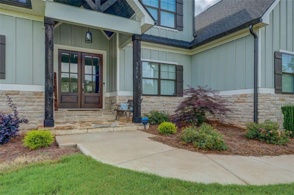 3076 East Lake Road McDonough, GA 30252 - Photo 3 of 49 a front view of a house with garden