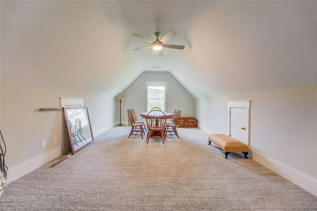 a bathroom with a granite countertop sink mirror and toilet