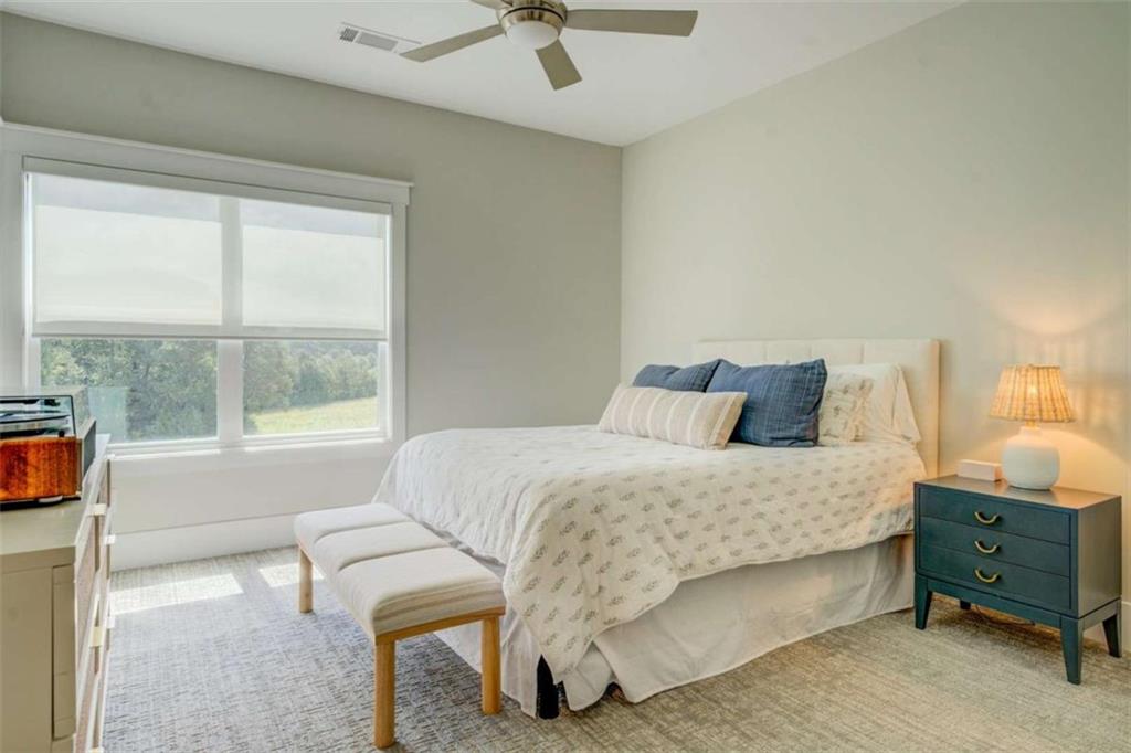 3076 East Lake Road McDonough, GA 30252 - Photo 38 of 49 a bedroom with a bed and a window