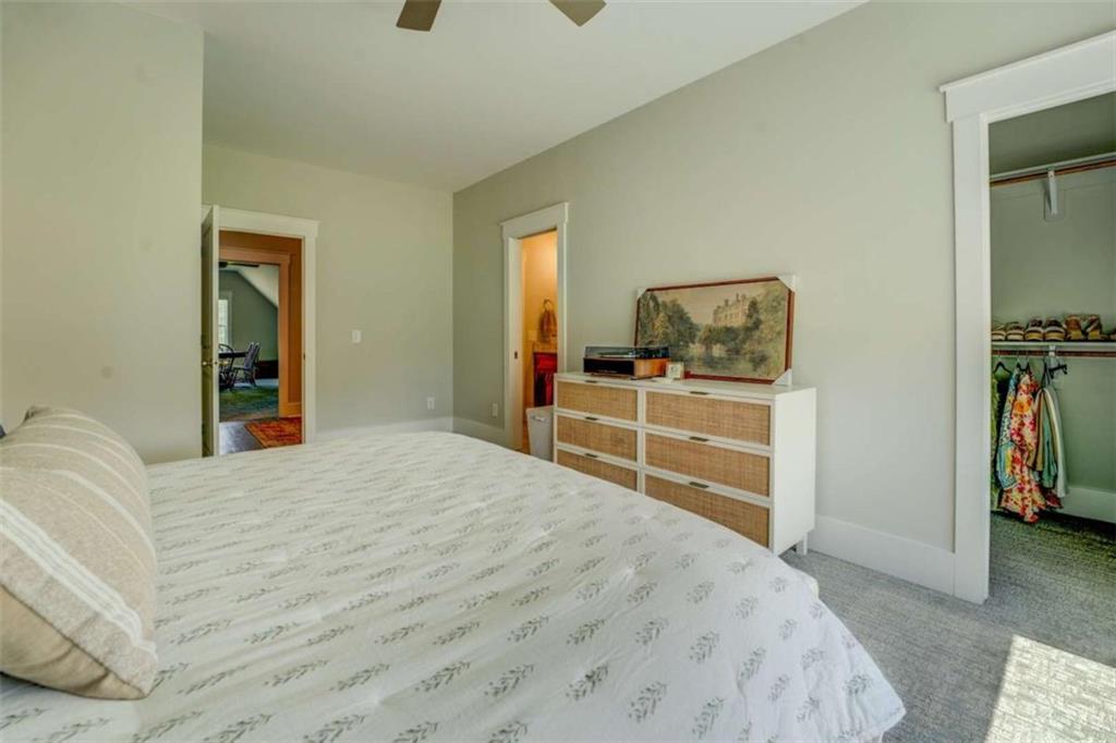 3076 East Lake Road McDonough, GA 30252 - Photo 39 of 49 a bedroom with a bed and a flat screen tv