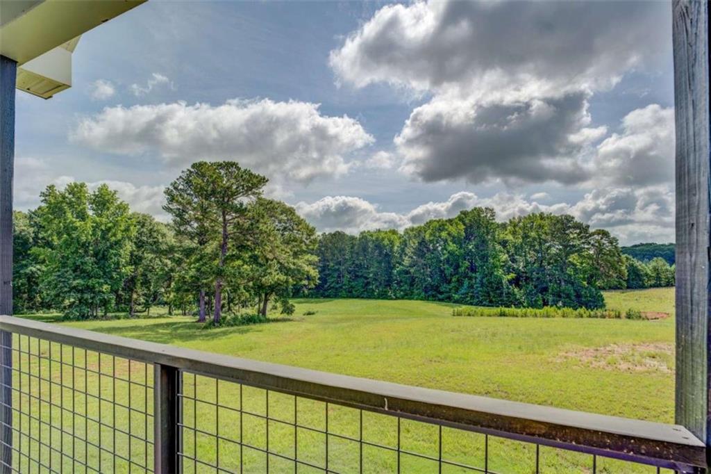 3076 East Lake Road McDonough, GA 30252 - Photo 43 of 49 a view of a swimming pool and trees in the background