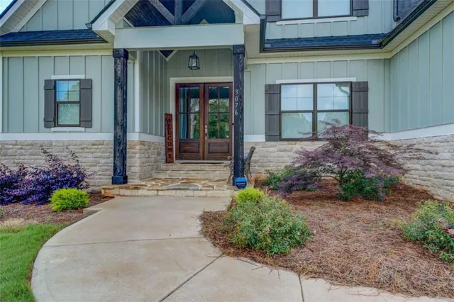 a front view of house with outdoor seating and yard