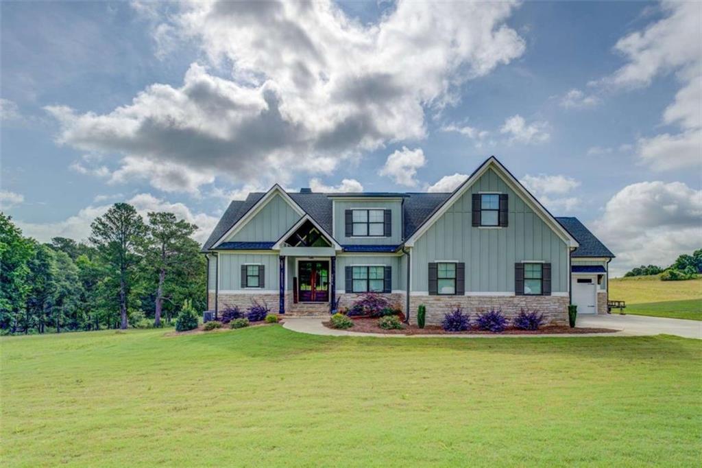 3076 East Lake Road McDonough, GA 30252 - Photo 48 of 49 a front view of house with outdoor seating and yard