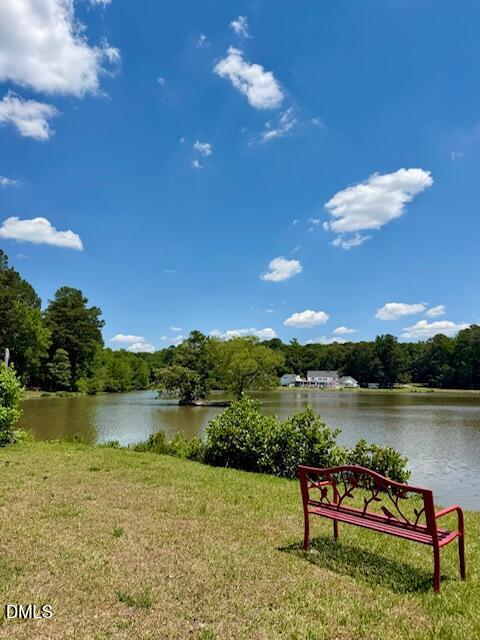 6016 River Lake Circle Raleigh, NC 27604 - Photo 2 of 20 a view of a lake with couches chairs