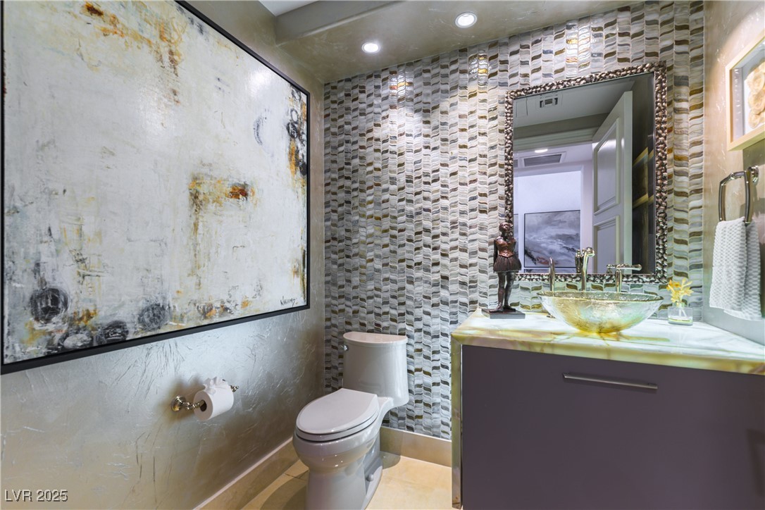 9101 Alta Drive, Unit 505 Las Vegas, NV 89145 - Photo 18 of 64 Half bathroom with vanity, tile patterned floors, and recessed lighting