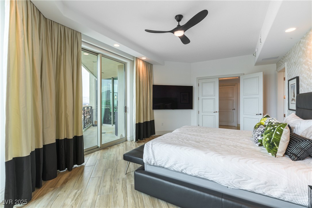 9101 Alta Drive, Unit 505 Las Vegas, NV 89145 - Photo 23 of 64 Bedroom with access to outside, light wood-style flooring, recessed lighting, and ceiling fan