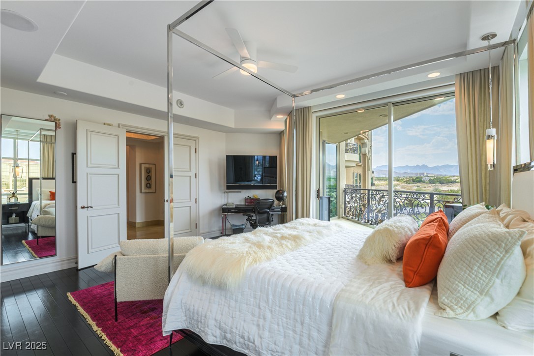 9101 Alta Drive, Unit 505 Las Vegas, NV 89145 - Photo 37 of 64 Bedroom featuring multiple windows, access to outside, dark wood-style floors, ceiling fan, and recessed lighting