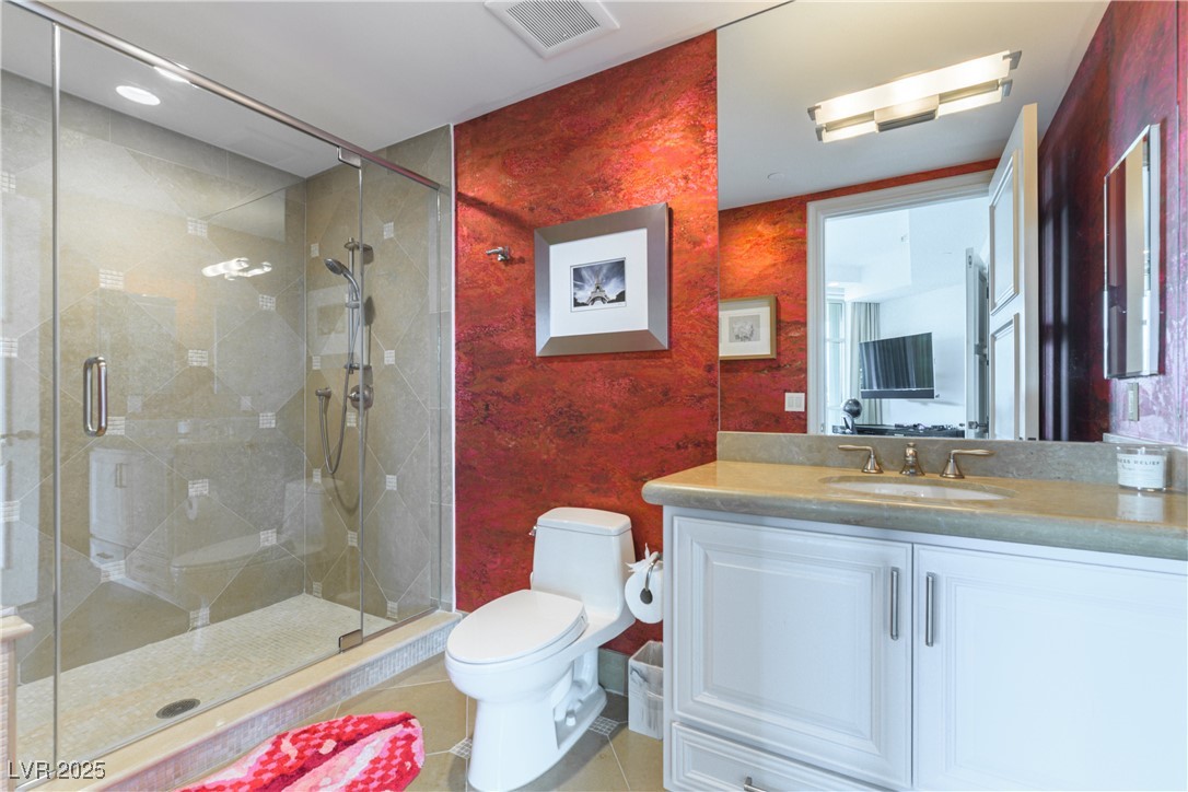 9101 Alta Drive, Unit 505 Las Vegas, NV 89145 - Photo 41 of 64 Bathroom featuring vanity, a stall shower, and tile patterned flooring