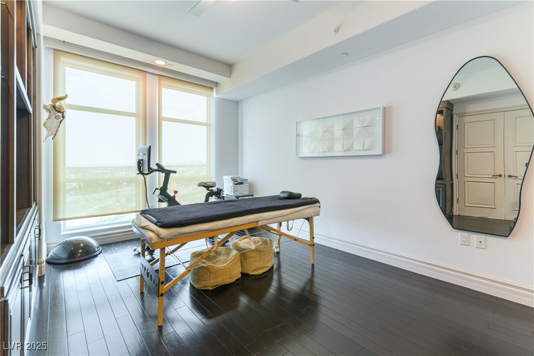 9101 Alta Drive, Unit 505 Las Vegas, NV 89145 - Photo 43 of 64 Home office with dark wood-style floors and a water view