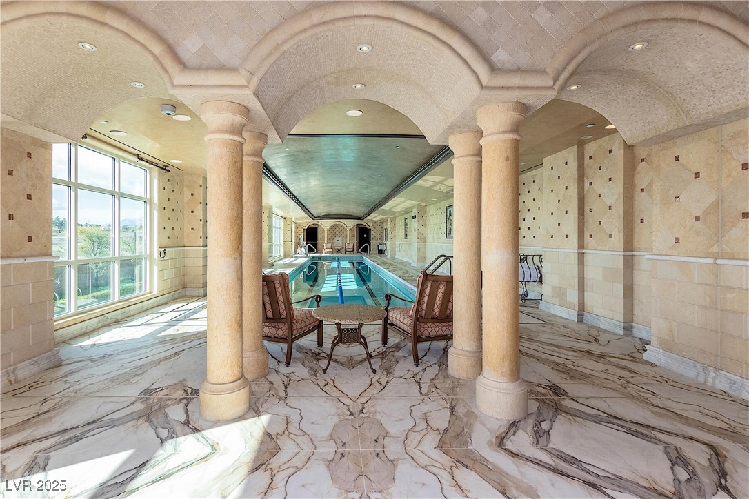9101 Alta Drive, Unit 505 Las Vegas, NV 89145 - Photo 58 of 64 Indoor community pool with ornate columns