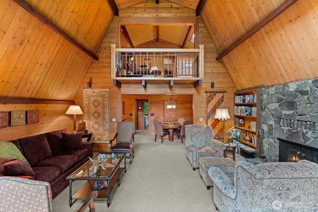 a view of a porch with furniture and front door