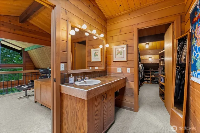 a bedroom with a bed and a night stand