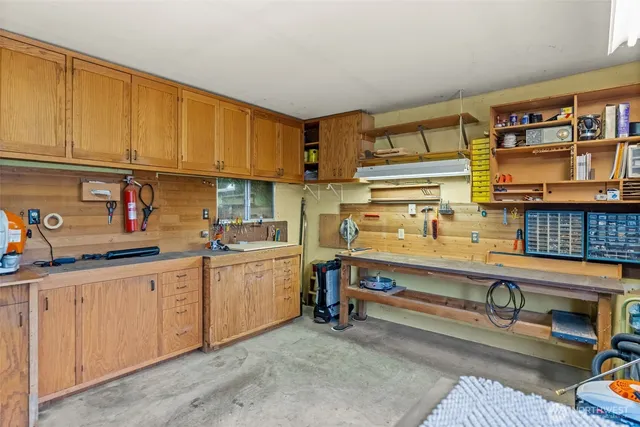 an aerial view of a house with a yard and garden