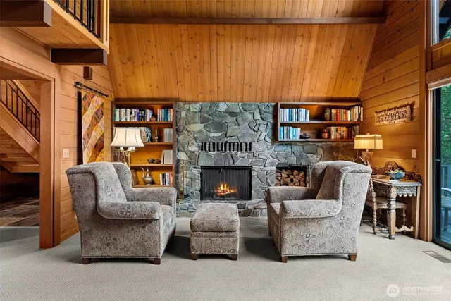 a balcony with wooden floor and outdoor seating
