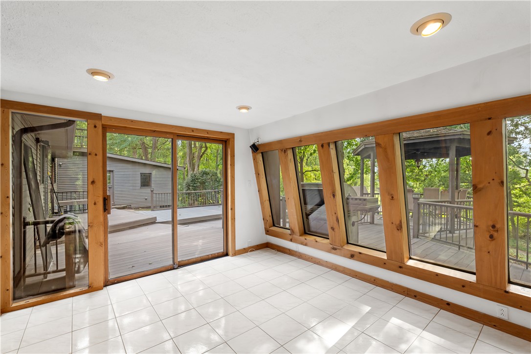 301 Spring Street Avon, NY 14414 - Photo 26 of 50 Sunroom with access to the deck, gazebo, and views of the park