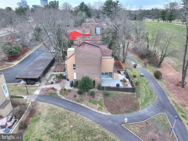 an aerial view of a house with a yard basket ball court and outdoor seating