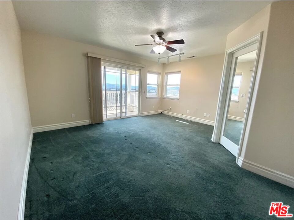 7173 Barker Road Oak Hills, CA 92344 - Photo 16 of 26 a view of an empty room with a window
