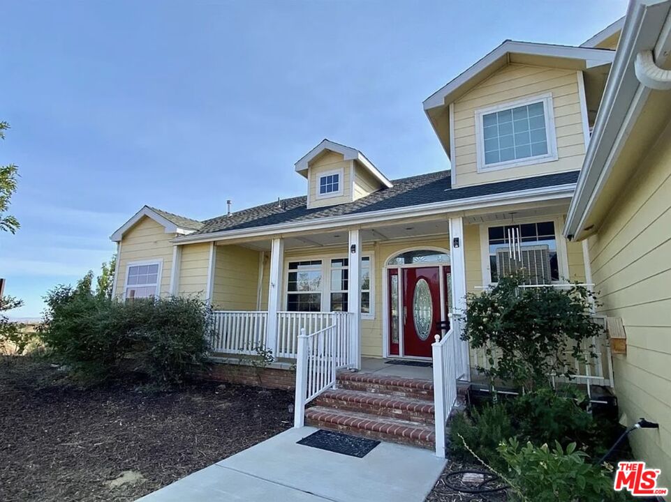 7173 Barker Road Oak Hills, CA 92344 - Photo 2 of 26 a front view of a house with plants