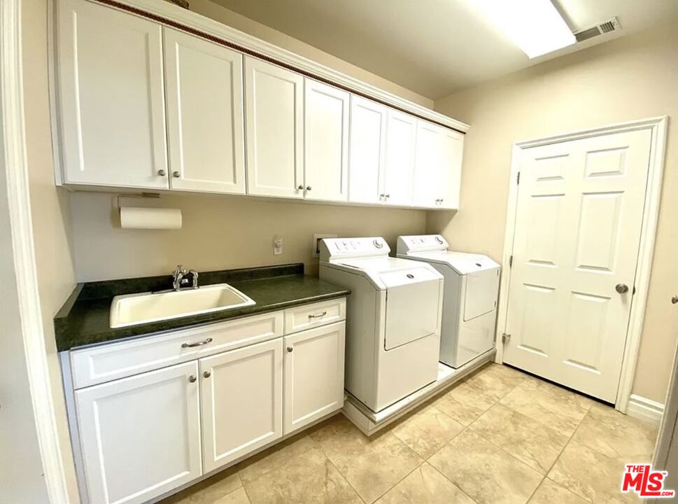 7173 Barker Road Oak Hills, CA 92344 - Photo 23 of 26 a utility room with dryer and washer