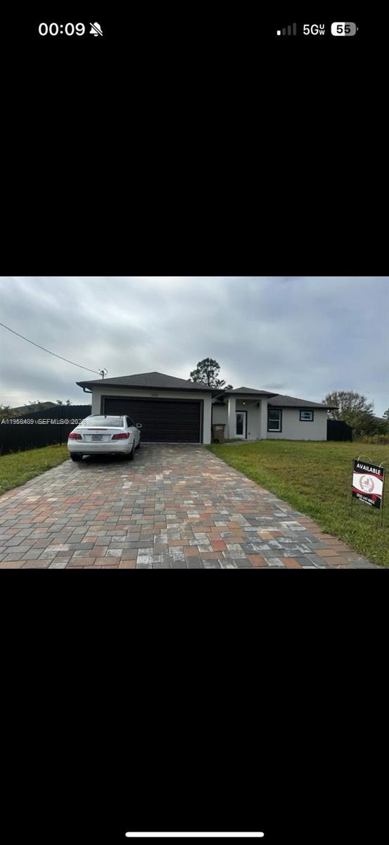 868 Cervantes Street East Lehigh Acres, FL 33974 - Photo 18 of 18 a view of swimming pool from yard