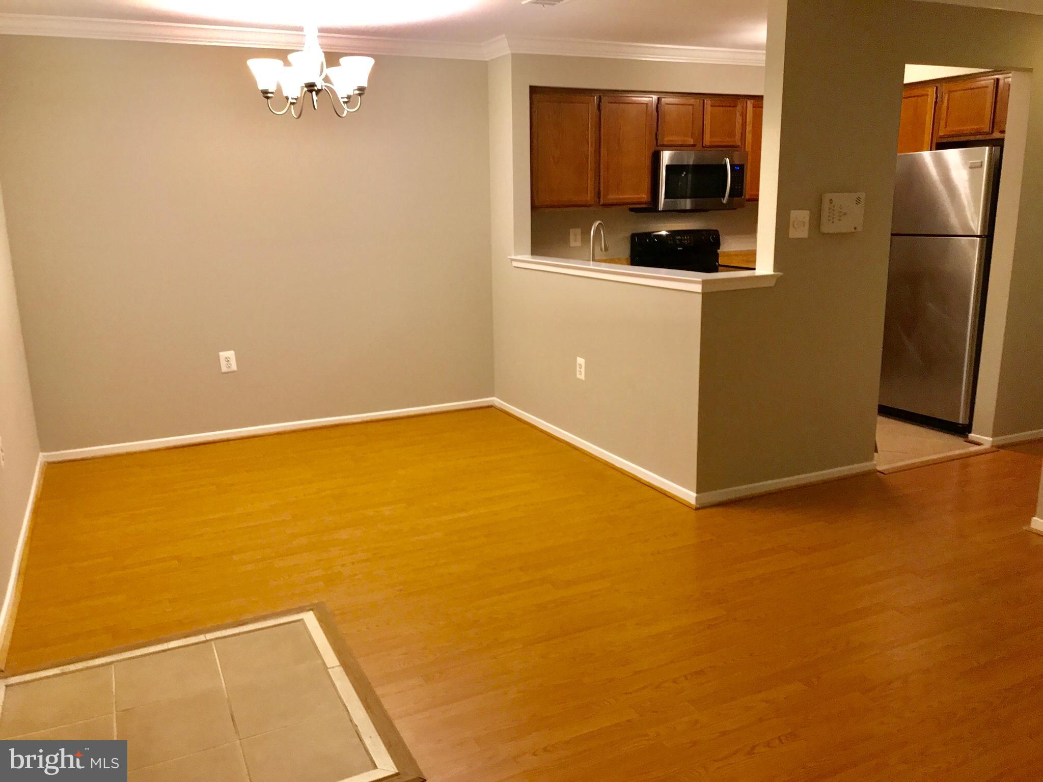 7702 Lexton Place, Unit 65 Springfield, VA 22152 - Photo 2 of 24 a view of a room with a refrigerator