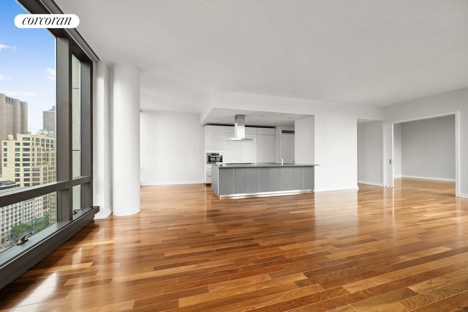 101 Warren Street, Unit 1720 Manhattan, NY 10007 - Photo 7 of 21 a view of empty room with wooden floor and kitchen view
