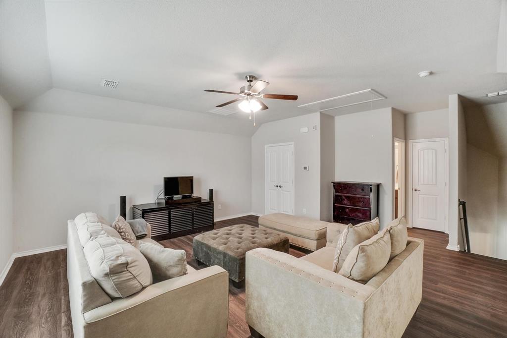 a living room with furniture fireplace and a flat screen tv