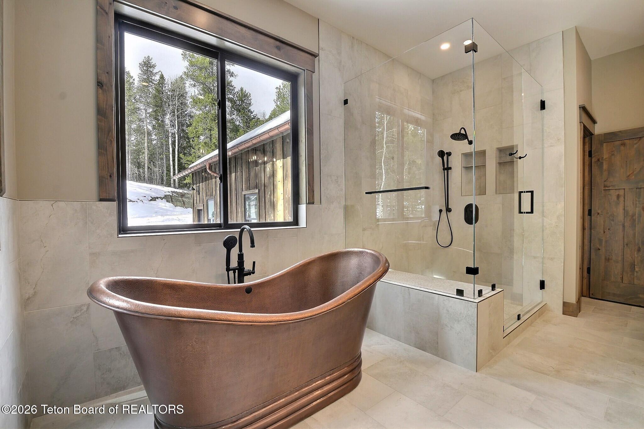 5727 Forest Ridge Road Victor, ID 83455 - Photo 36 of 76 Master Bathroom with Copper Tub